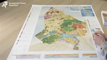 Geological Map of the Kingdom of the Netherlands lying on a table